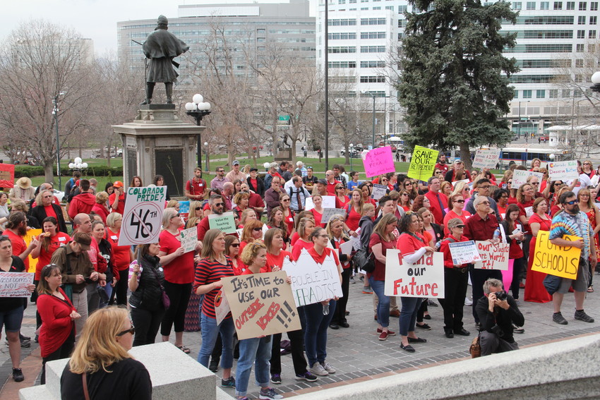 Educators hold a rally on the west steps of the state Capitol April 16. The group also marched on the Capitol grounds before entering the building around 10 a.m.
